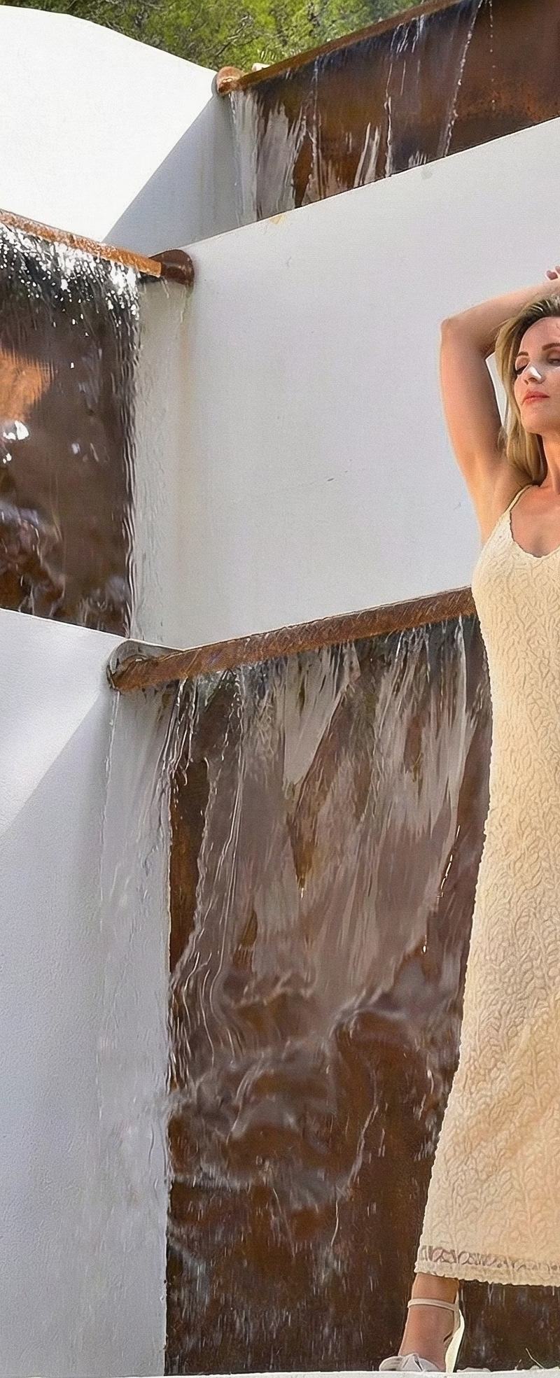 Close-up of a modern tiered waterfall feature with corten steel edges